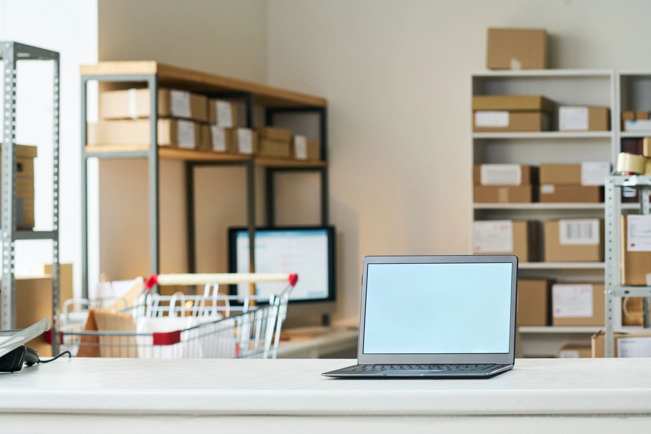 Order Pickup Counter Displaying Laptop in E Commerce Fulfillment Hub